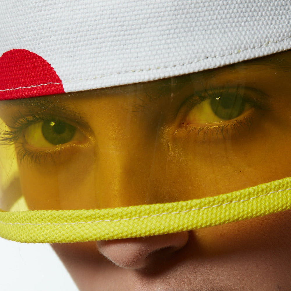 Maria wearing a summer buckethat with yellow visor.