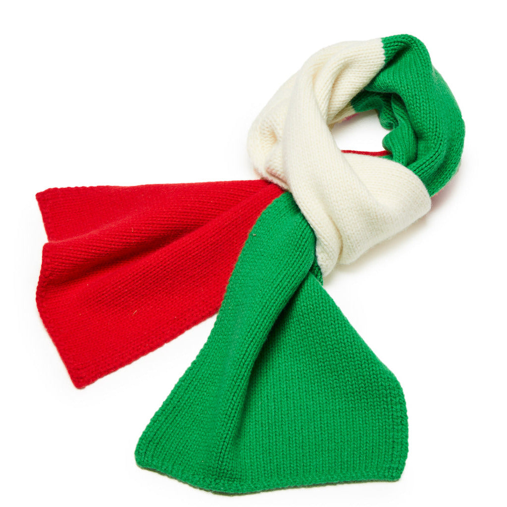 Knitted scarf with red, green, and white sections on a white background
