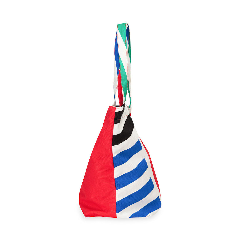Colorful striped bag with a red, blue, and green pattern on a white background