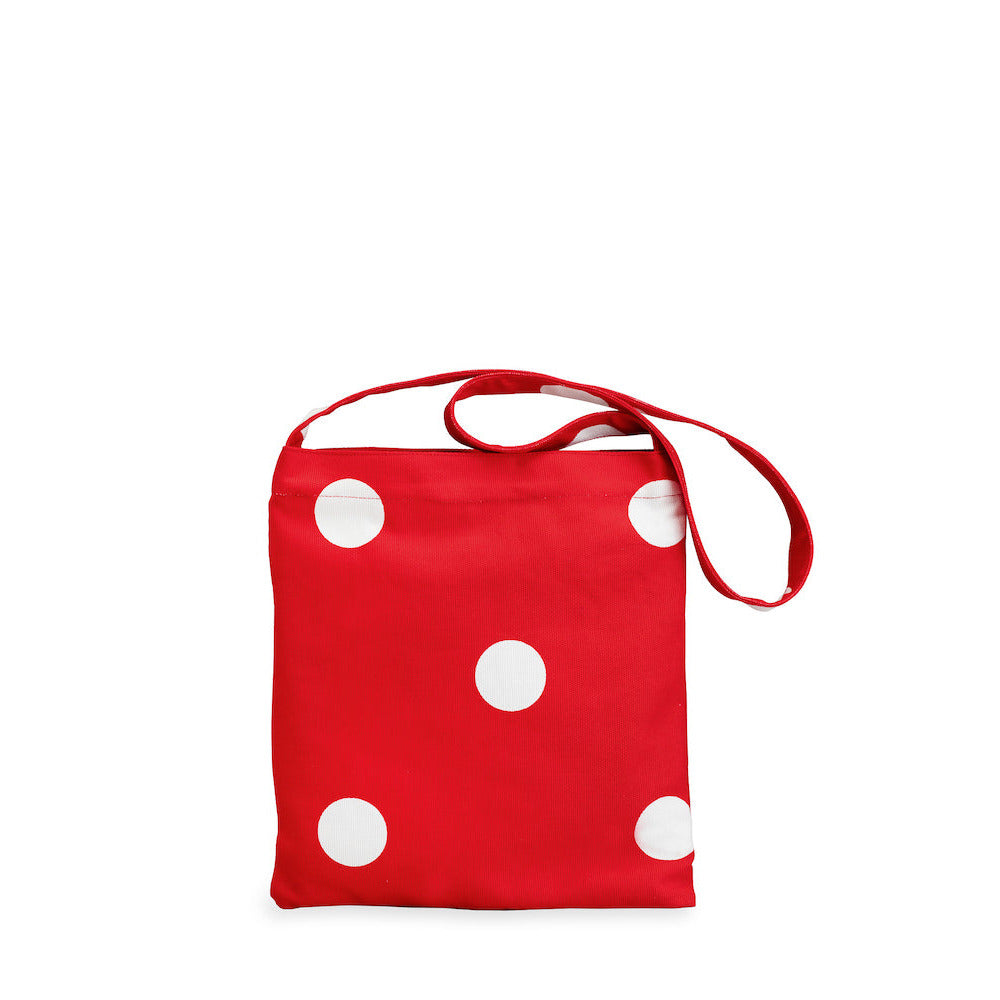 Red bag with white polka dots on a white background