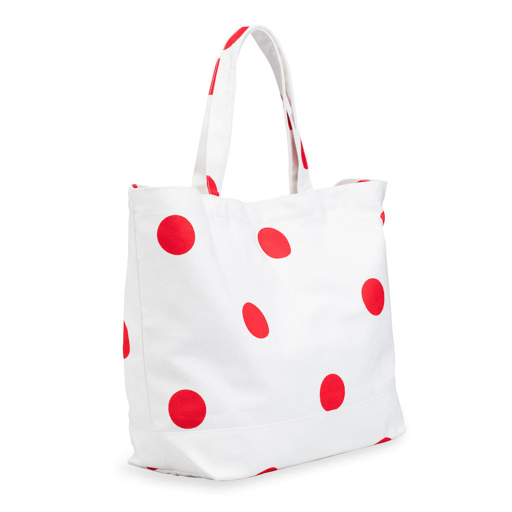 White tote bag with red polka dots on a white background