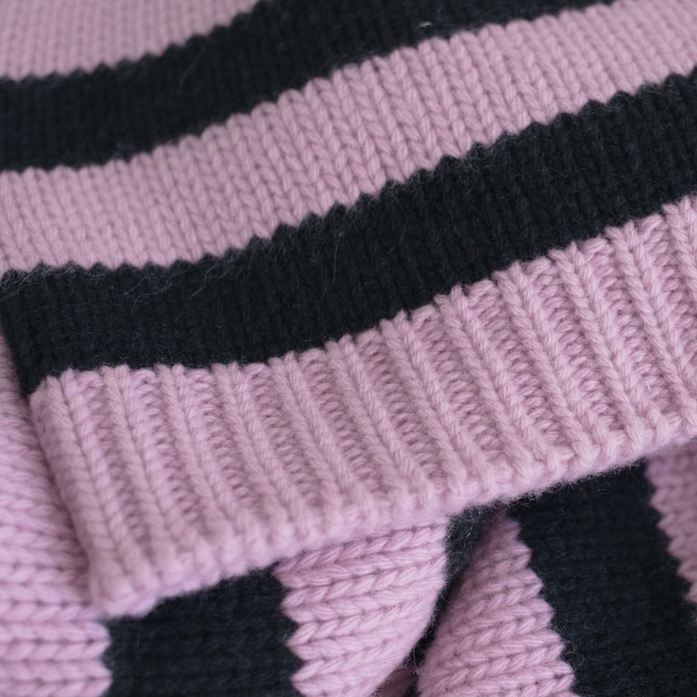 Close-up of pink and black striped cashmere beanie