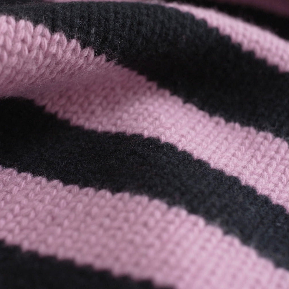 Close-up of pink and black striped cashmere scarf