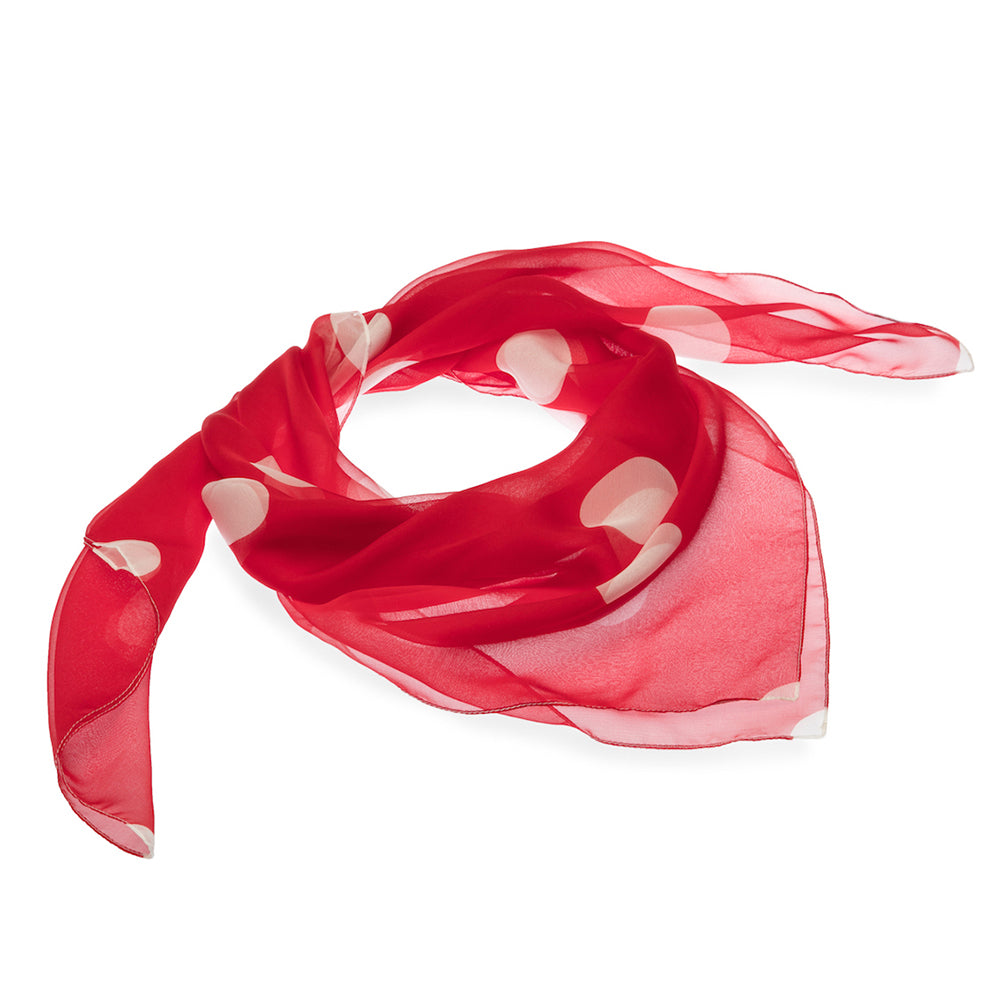 Red scarf with white polka dots on a white background