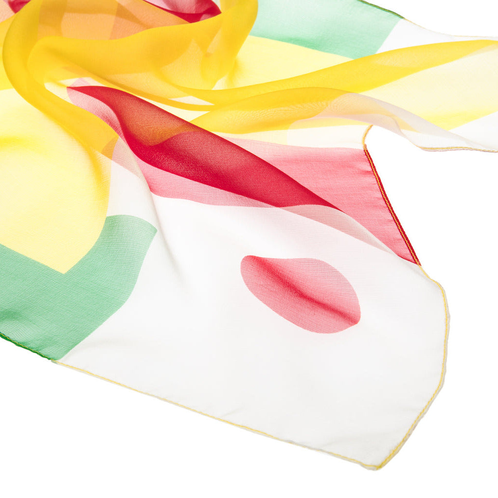Colorful silk foulard with a red dot and a yellow, green and red pattern on a white background