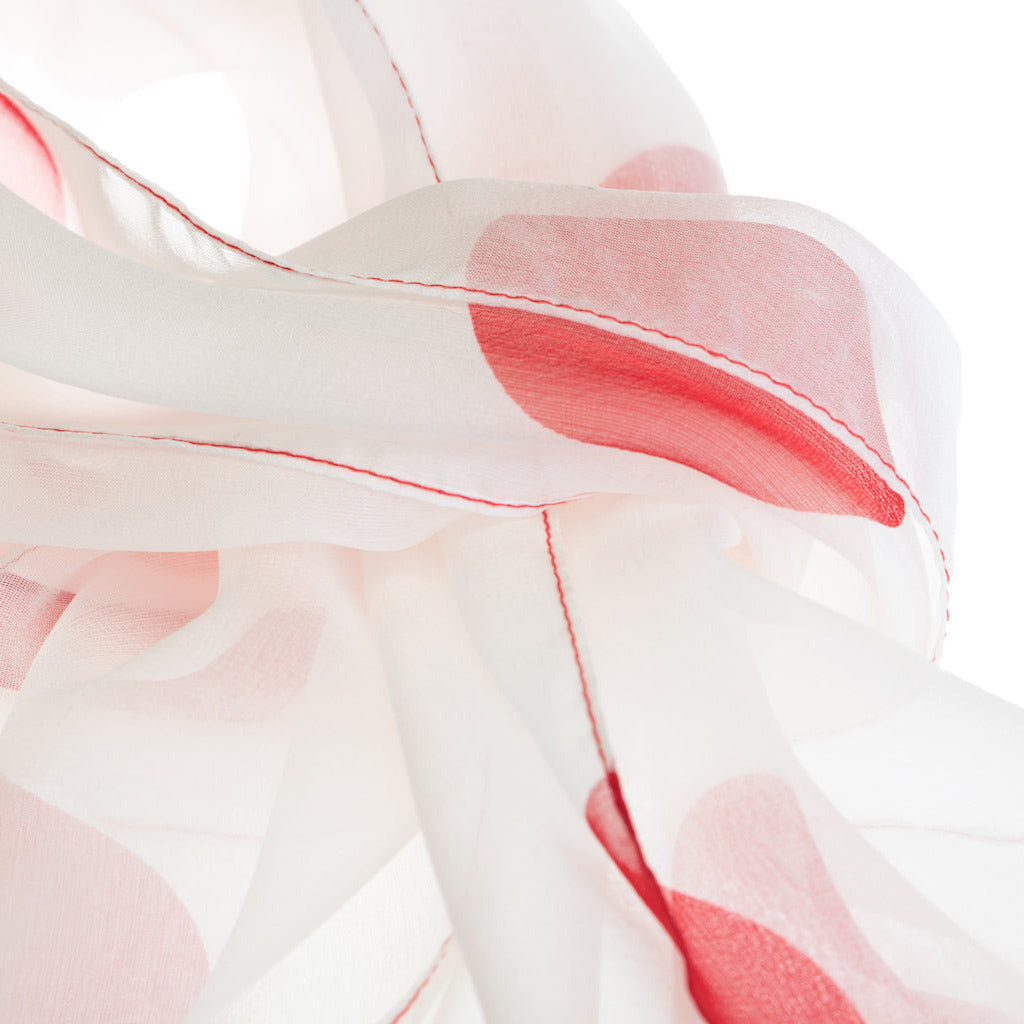 Close-up of a white silk foulard with a polkadot pattern on a white background