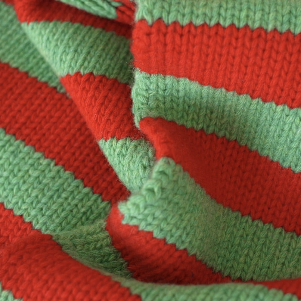 Close-up of red and green striped wool scarf
