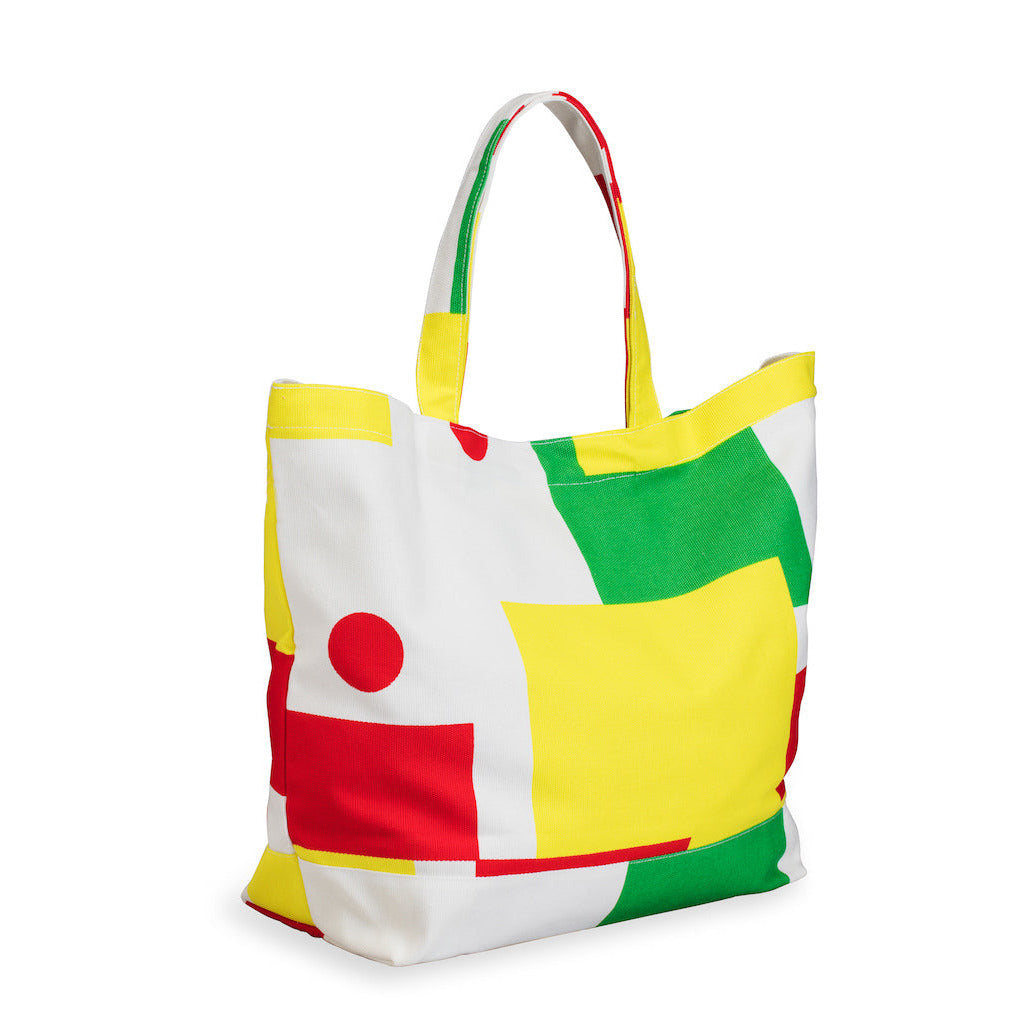 Colorful tote bag with geometric patterns on a white background
