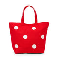 Red tote bag with white polka dots on a white background