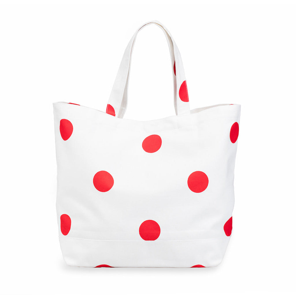 White tote bag with red polka dots on a white background