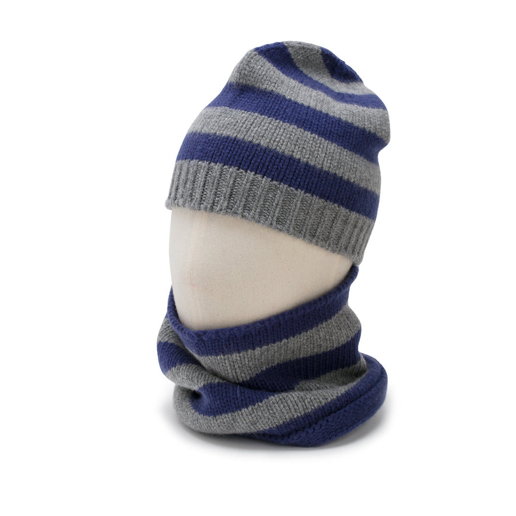 Striped blue and gray knit hat and scarf set on a mannequin head against a white background